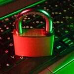 Red padlock on a computer keyboard