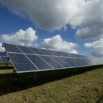 Solar panels in a green field